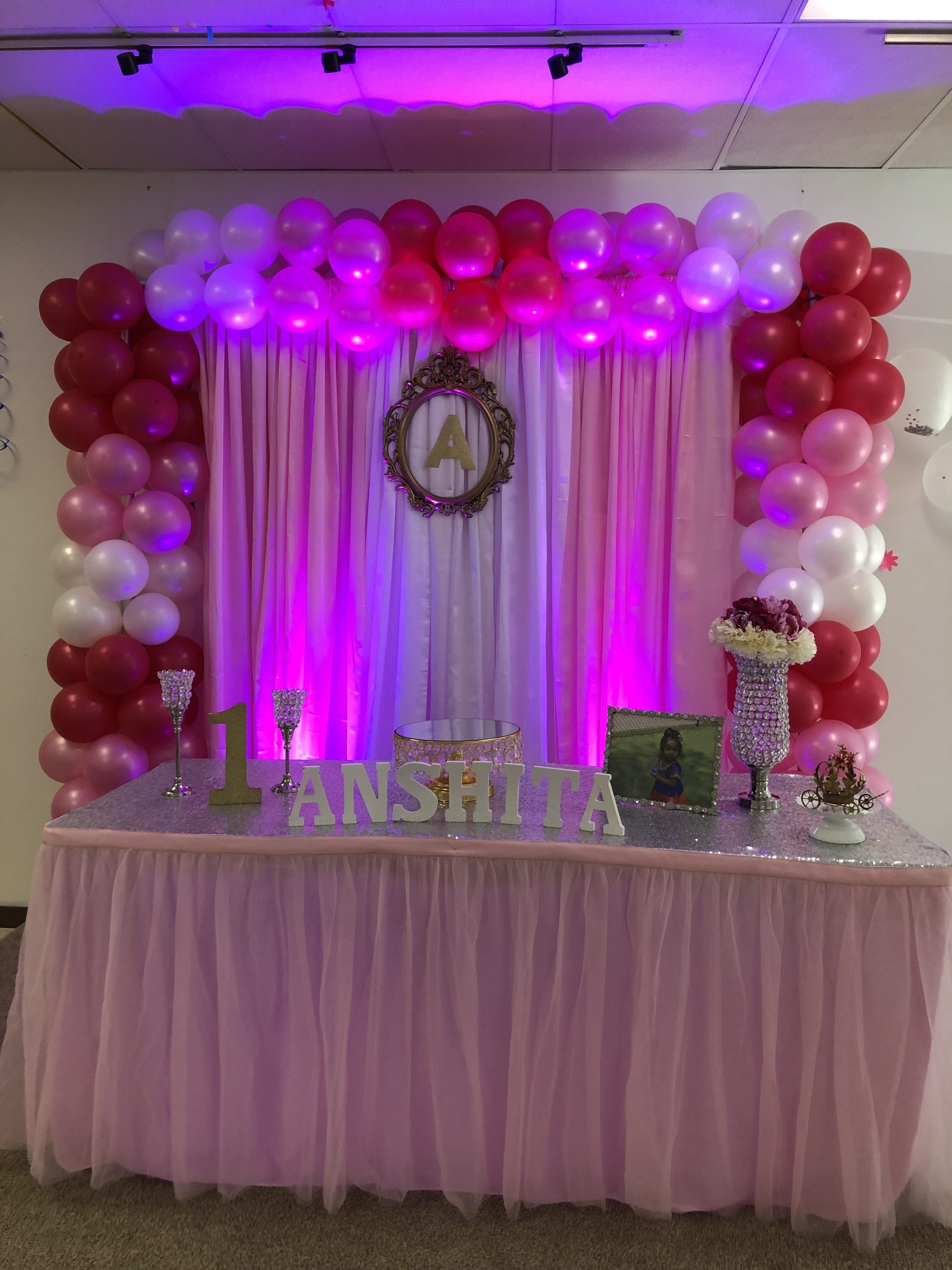 Baby Girl First Birthday Decorations at Biryani Pot , Duluth . Backdrop with Balloon structure .