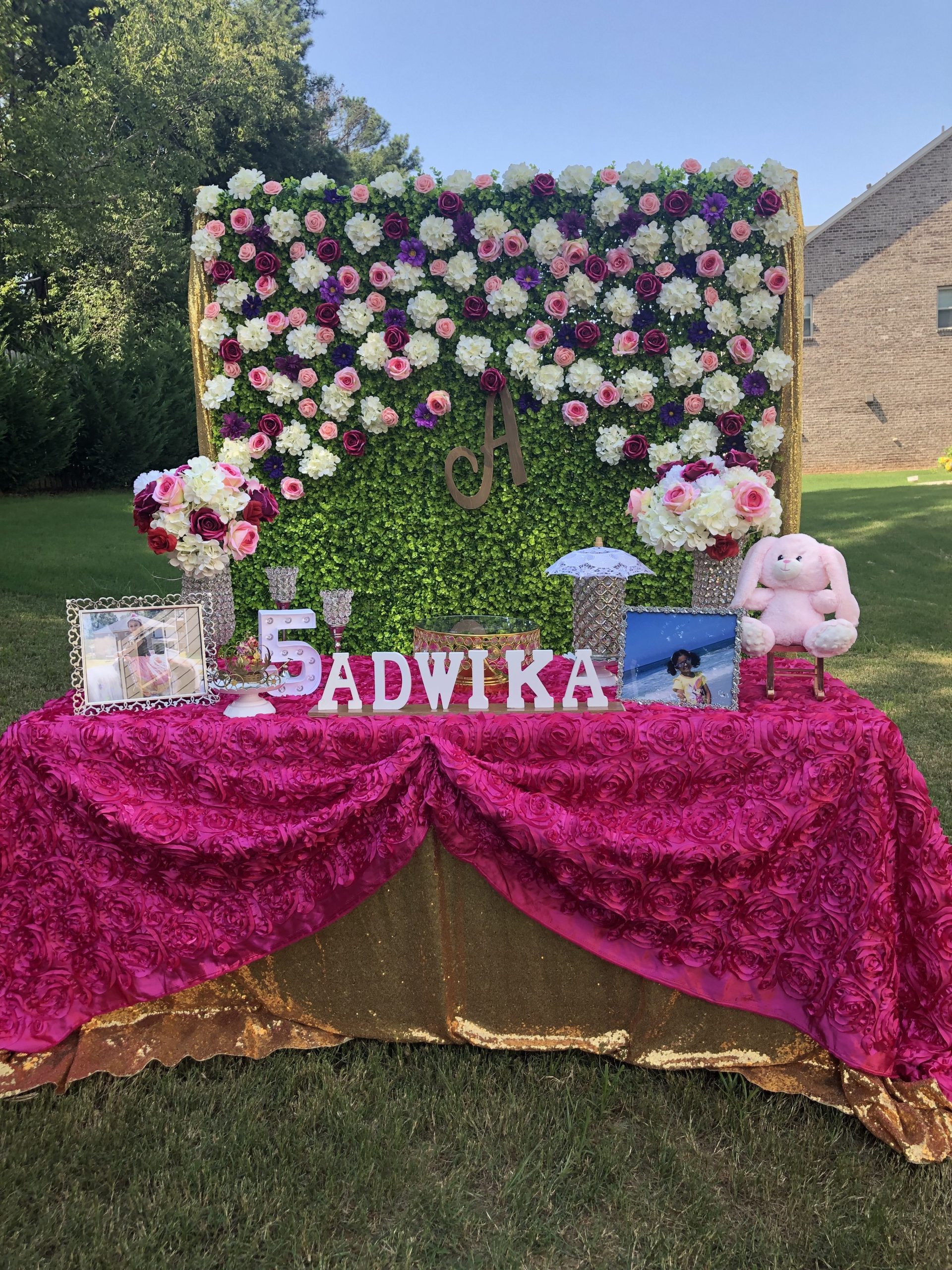 5th birthday outdoor decorations Grass backdrop with flowers in Alpharetta GA